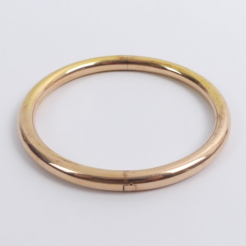 60G - 10ct rose gold, concealed clasp, oversize bangle, 16.9 grams, 7.1mm, internal circumference 22cm.