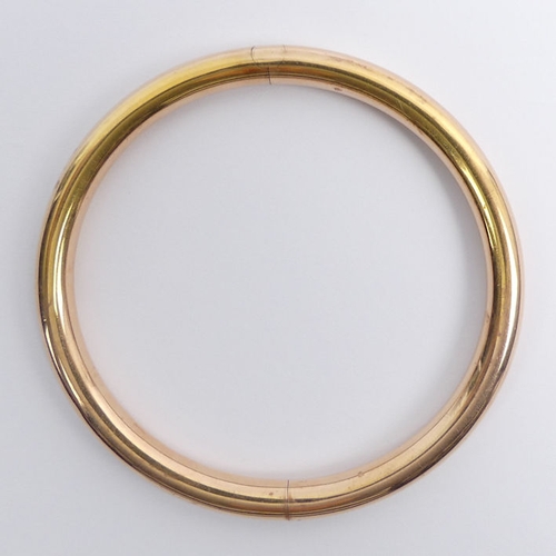 60G - 10ct rose gold, concealed clasp, oversize bangle, 16.9 grams, 7.1mm, internal circumference 22cm.