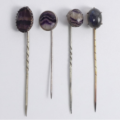 83 - Three Blue John stick pins and a labradorite example, longest 64mm.