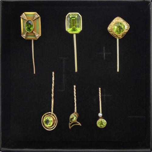 84 - Six Victorian 9ct gold peridot set stick pins, 11.6 grams, longest 67mm.