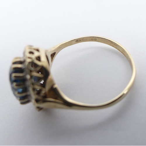 91 - 9ct gold, blue topaz and diamond ring, 2.8 grams, 13.6mm, size M.