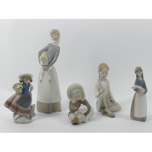 326 - Five Lladro figures, 1195 'Eskimo', 1011 'Girl Holding Piglet', 5221 'Sweet Scent', a lady holding a... 