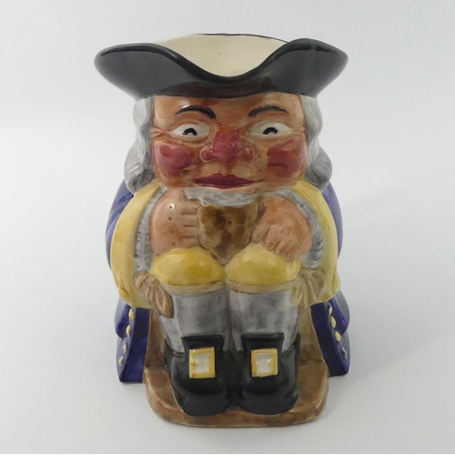 340 - A medium Clarice Cliff for Newport Pottery Toby Jug, marks to base, 17 cm.