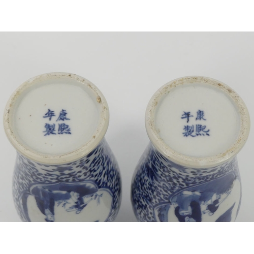 342 - A pair of 19th century Chinese, blue and white vases, marks to base, 19cm.