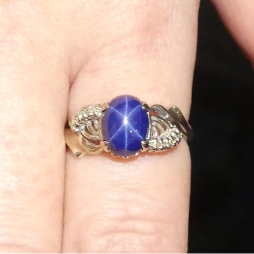 8 - 14ct white gold, star sapphire and diamond ring, 3.9 grams, 9.5mm, size O 1/2.