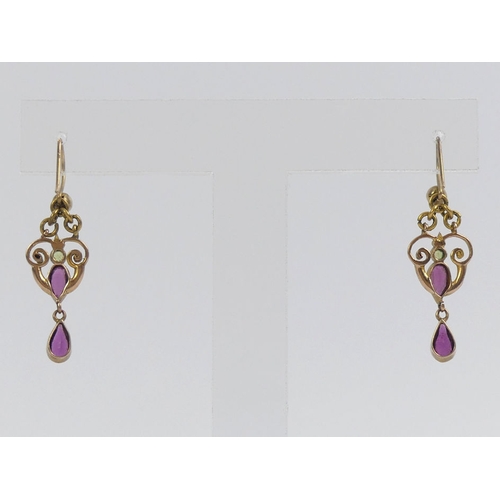 99F - A pair of gold, garnet,  peridot and seed pearl drop earrings, 2.2 grams, 33mm long excluding wire.