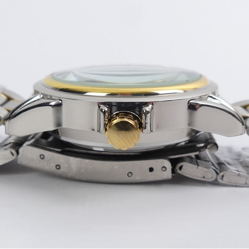 106 - A Genoa stainless steel two tone, automatic, skeleton dial watch, 42 mm wide.
Condition Report: In g... 