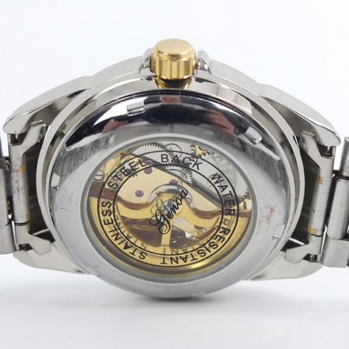 106 - A Genoa stainless steel two tone, automatic, skeleton dial watch, 42 mm wide.
Condition Report: In g... 