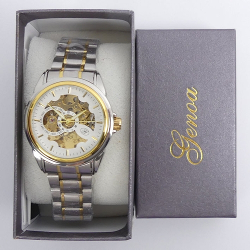 106 - A Genoa stainless steel two tone, automatic, skeleton dial watch, 42 mm wide.
Condition Report: In g... 