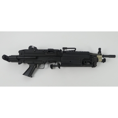 An airsoft FN minima light machine gun in a hard plastic case, 80cm. No ...
