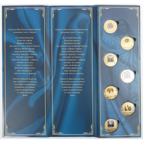 Three cased sets of gold plated Vatican medallions with pad print and ...