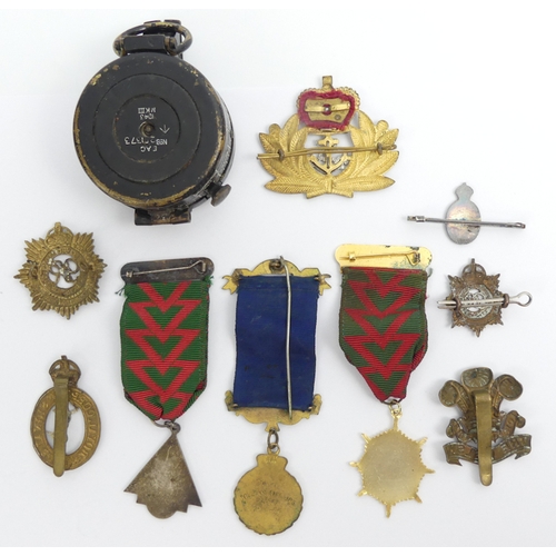 A MKIII 1943 marching compass, a Royal Navy Officer's cap badge, four ...