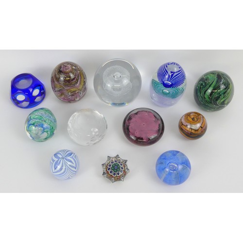 Twelve assorted glass paperweights including Caithness and Strathearn ...