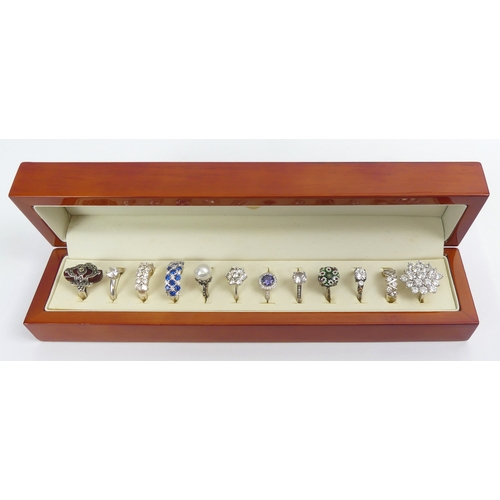 Twelve variously set silver rings in a fitted display box, 87 grams ...