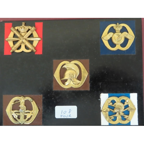 108 - Eighteen 20thC European Armies cap / Helmet badges mounted on boards