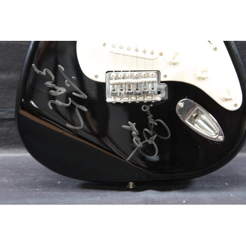 110 - Black Fender Squire Stratocaster purported to be signed by Cream (Ginger Baker signature faded from ... 