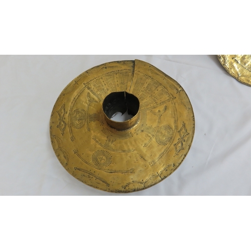 157 - Pair of African brass disc shaped mounts for poles with hammered geometric design decoration. Diam 1... 