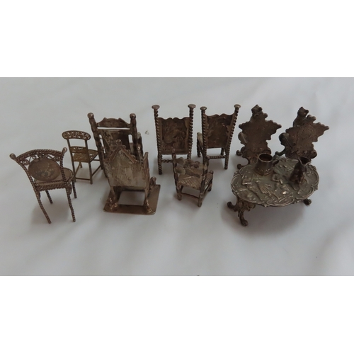 159 - Collection 19thC miniature silver furniture chairs, table and cats on chairs - tallest 2 ins., mostl... 