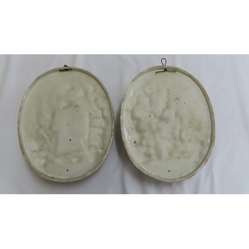 174 - Pair of Meissen style oval porcelain plaques with decoration in relief of a lady with basket of flow... 