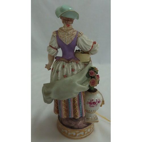 178 - 19thC Meissen porcelain figure of the flower seller - Ht. 7.75 ins., crossed swords in underglaze bl... 