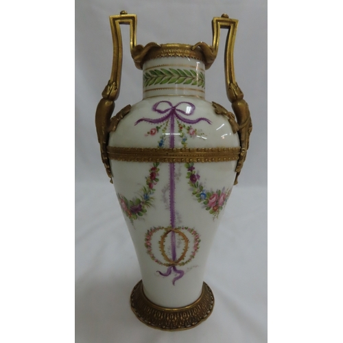 179 - French porcelain ormolu mounted urn with floral swag and ribbon decoration - Ht. 11.25 ins.