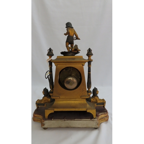 180 - A 19thC French ormolu and bronze mantel clock with Egyptian decoration, porcelain dial chiming on a ... 