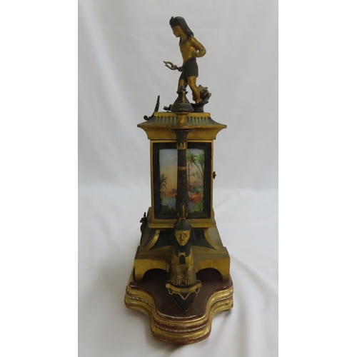 180 - A 19thC French ormolu and bronze mantel clock with Egyptian decoration, porcelain dial chiming on a ... 