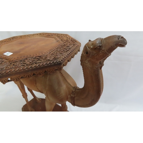 202 - An Anglo-Indian carved teak occasional table modelled as a camel, circa 1900. The octagonal top and ... 