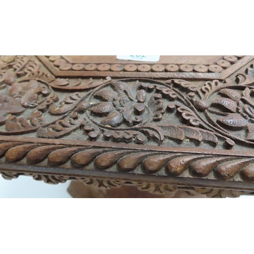 202 - An Anglo-Indian carved teak occasional table modelled as a camel, circa 1900. The octagonal top and ... 