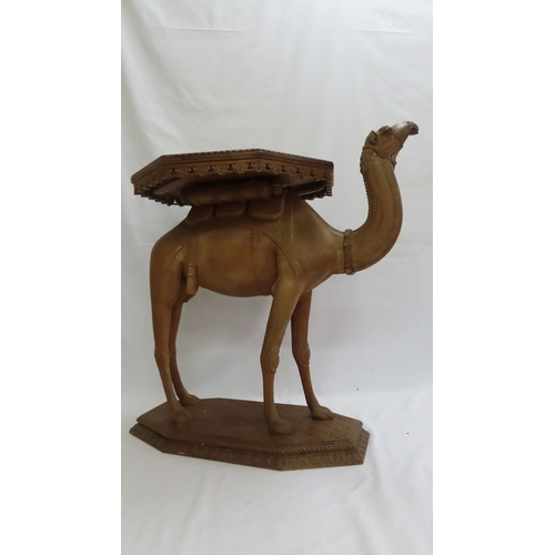 202 - An Anglo-Indian carved teak occasional table modelled as a camel, circa 1900. The octagonal top and ... 