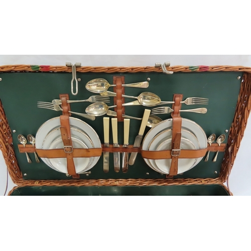 204 - An Edwardian picnic hamper for four persons complete with spirit stove, kettle, etc.