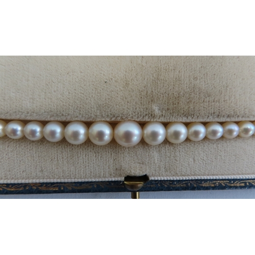 205 - Early 20thC graduated pearl necklace with diamond clasp - length 18 ins.