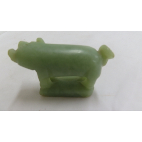 206 - Chinese pale green jade figure of a dog - 2.75 ins.