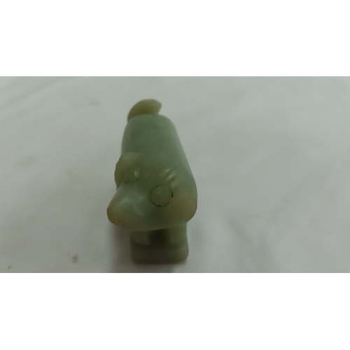 206 - Chinese pale green jade figure of a dog - 2.75 ins.