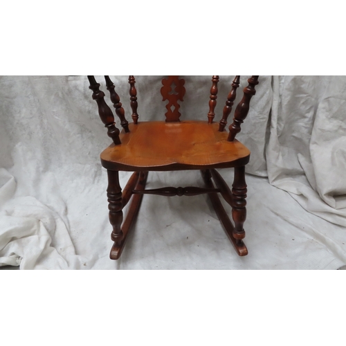 220 - Good quality Victorian yew wood comb back Windsor rocking chair matching lot 219. Ht. 42 ins., width... 