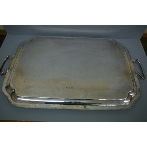 29 - A heavy Victorian silver two handled tray of rectangular form with shaped corners, crested, London 1... 