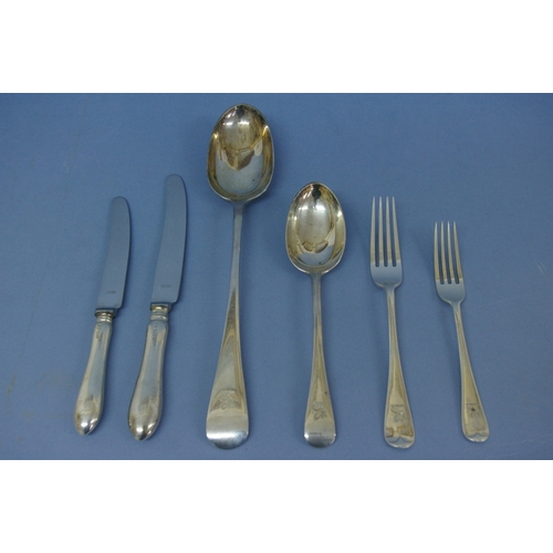 46 - An Edwardian set of silver flatware of plain form for twelve persons consisting of twelve serving sp... 