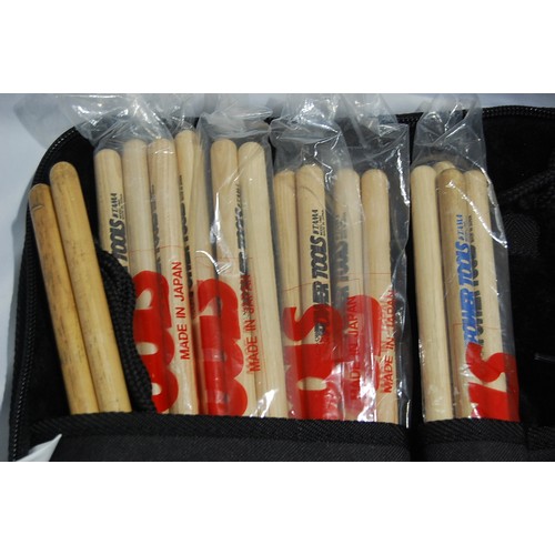 202 - Percussionists stick bag, containing numerous pairs of drums sticks mostly Tama, tuning key etc