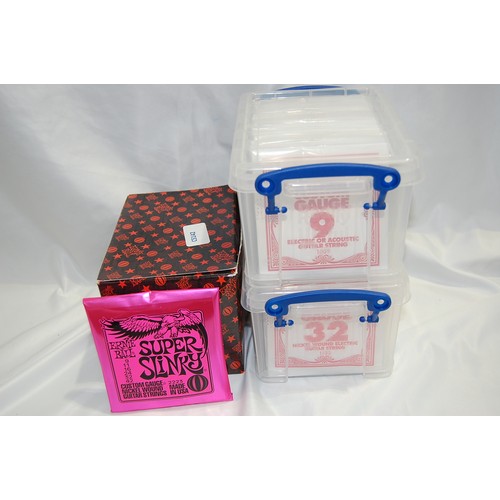 214 - numerous sets of Ernie Ball Super Slinky gauge 9-42 strings plus numerous amounts of Ernie Ball sing... 