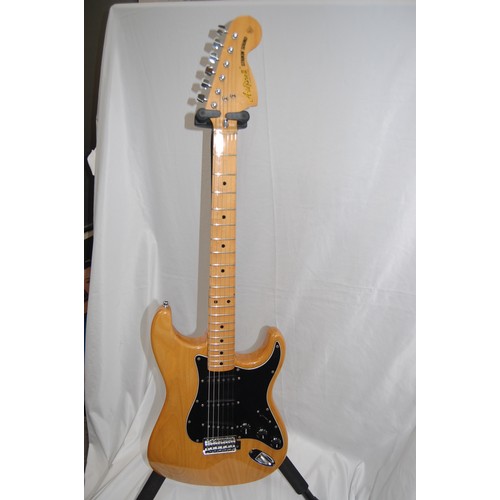 240 - Aria Pro II Strikin' Sounds blonde stratocaster shape electric guitar, black pickguard with black co... 