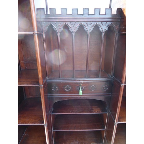 13 - A early 19th Century Gothic mahogany breakfront bookcase with five sections to each side, central ca... 