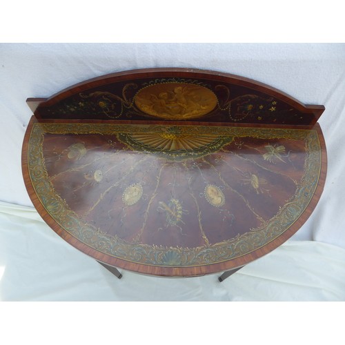 15 - A demi lune flamed Mahogany table with gallery back, having painted decoration in the Adams style on... 