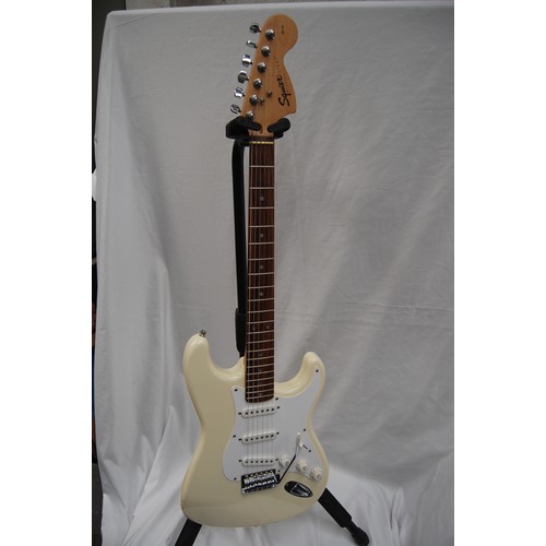 237 - Squire by Fender Stratocaster electric guitar - three single coil pickups, on white pickguard with c... 