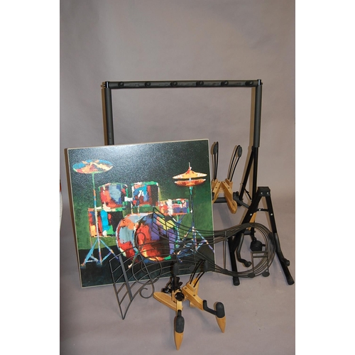 168 - Good collection of guitar stands, picture and wall hanging