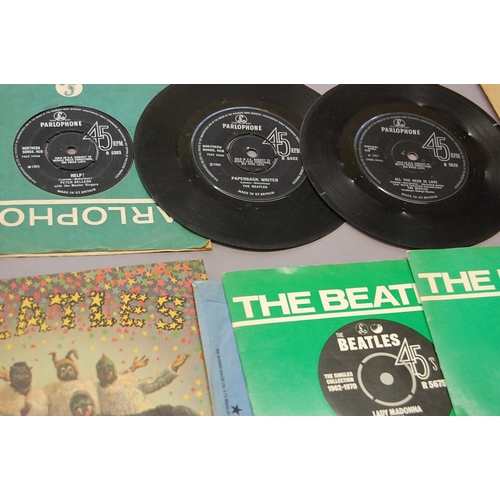 239 - Small collection of The Beatles singles - some empty sleaves