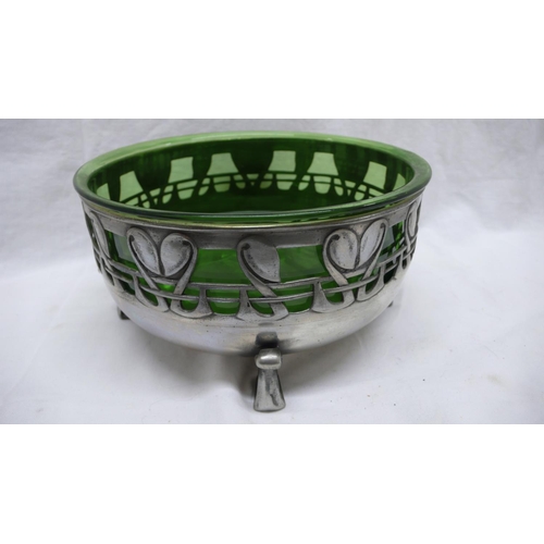 35 - Liberty & Co. Tudric Pewter fruit bowl with green glass liner and pierced foliate decoration on four... 