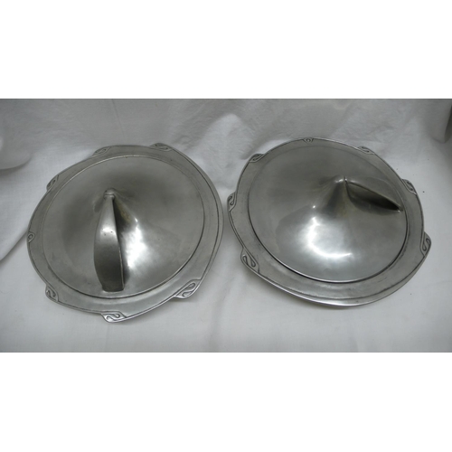 37 - Liberty & Co. English Pewter - a pair of entree dishes with shaped borders, conical shaped cover att... 