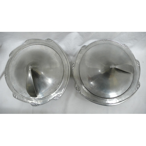 37 - Liberty & Co. English Pewter - a pair of entree dishes with shaped borders, conical shaped cover att... 