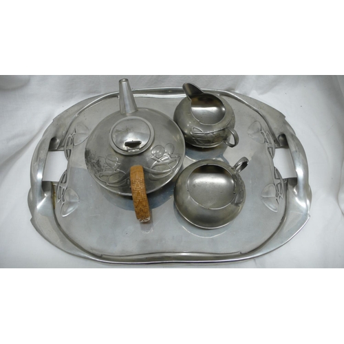 44 - Archibald Knox for Liberty & Co. English Pewter. Three piece tea service plus tray with foliate deco... 