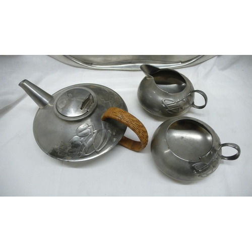 44 - Archibald Knox for Liberty & Co. English Pewter. Three piece tea service plus tray with foliate deco... 